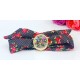 Montre fleur noire et rouge or bracelet tissu