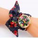 Montre fleur noire et rouge or bracelet tissu